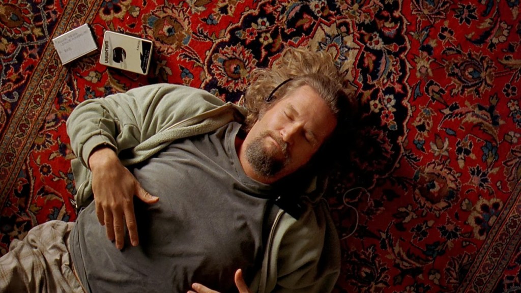 The Dude (Jeff Bridges) from The Big Lebowski, lying down with headphones on, blissful.